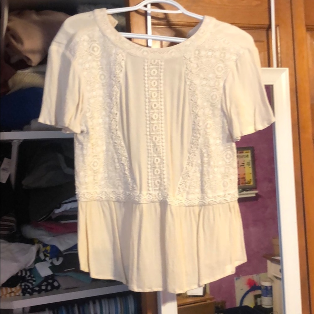 Cream colored short sleeve blouse